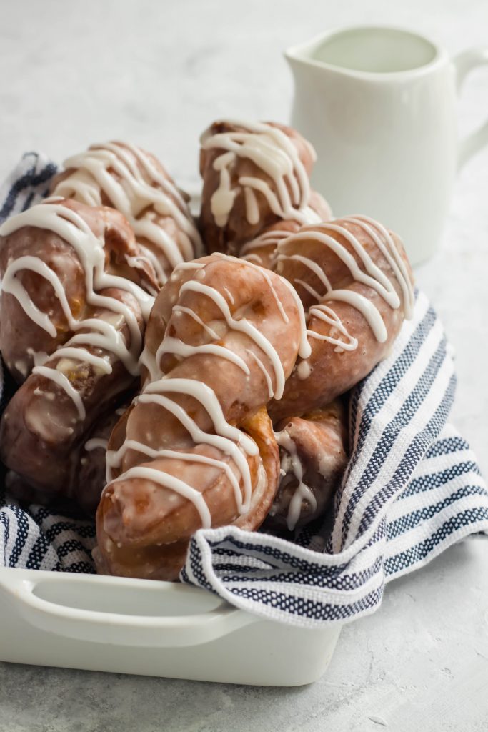 Cinnamon Roll Donuts with a white drizzle glaze