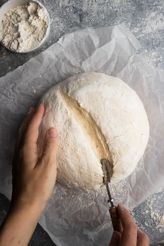 Scoring a dough loaf