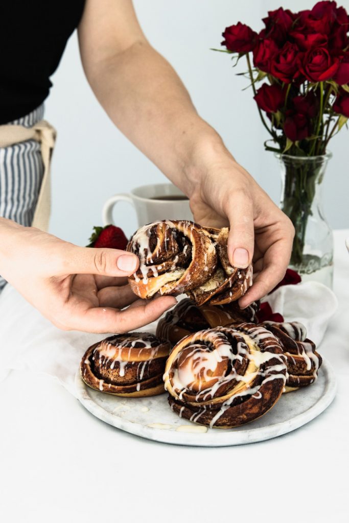 peeling apart the layers of sweet dough that make up these swirled Nutela rolls. 