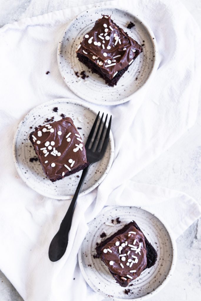 Three pieces of sourdough chocolate cake on plates