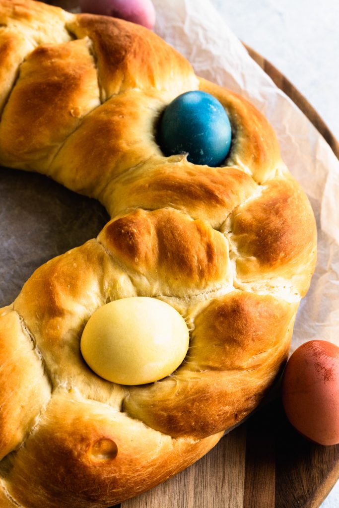 Italian Easter Bread is a braid circle loaf decorated on top with dyed Easter eggs.