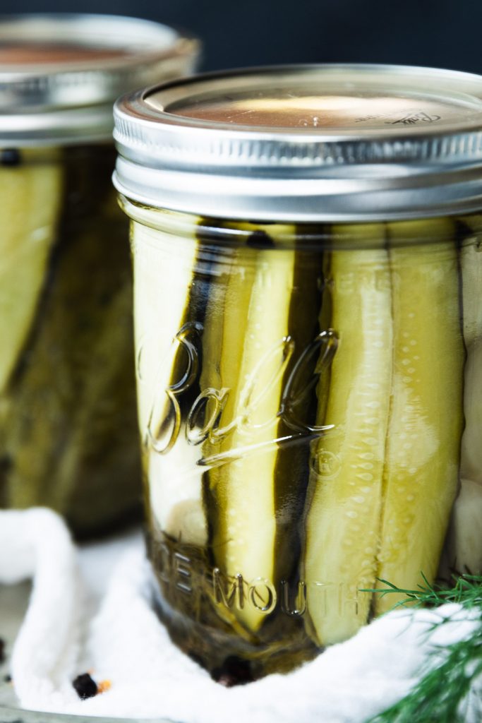 A jar of pickles made with this canned dill pickle recipe for fresh, crisp pickles year round.