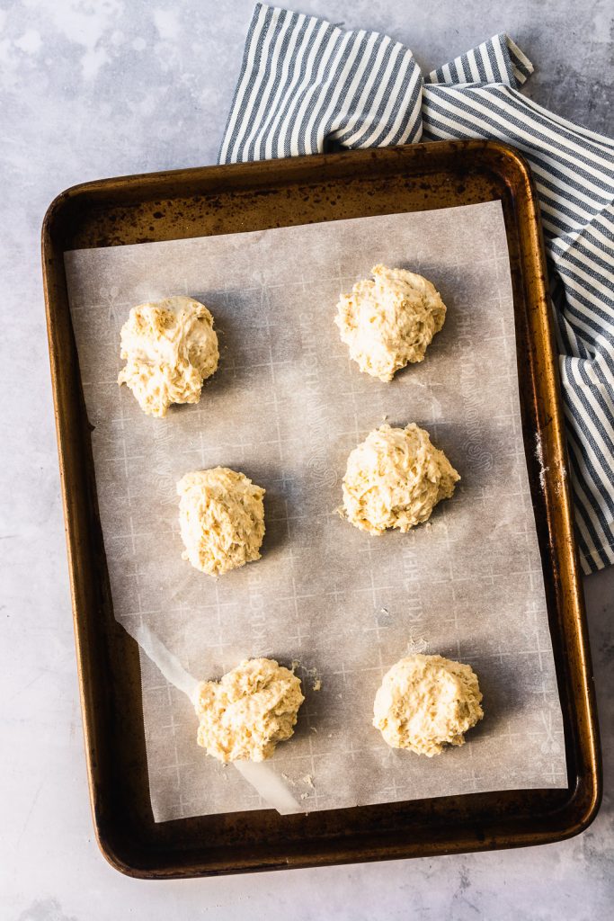 Scoop the buttermilk biscuit dough into 12 drop biscuits and bake them, 6 to a sheet. 