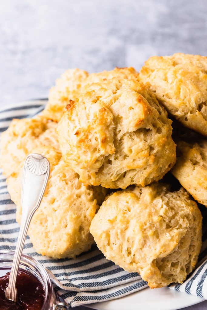 A plate piled high with buttermilk drop biscuits.