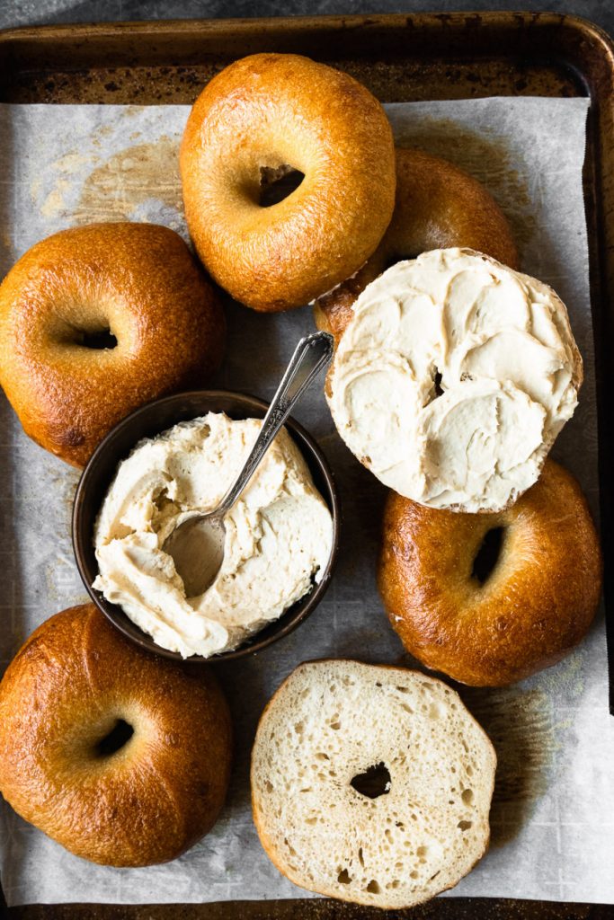 A tray of bagels and brown sugar cream cheese spread