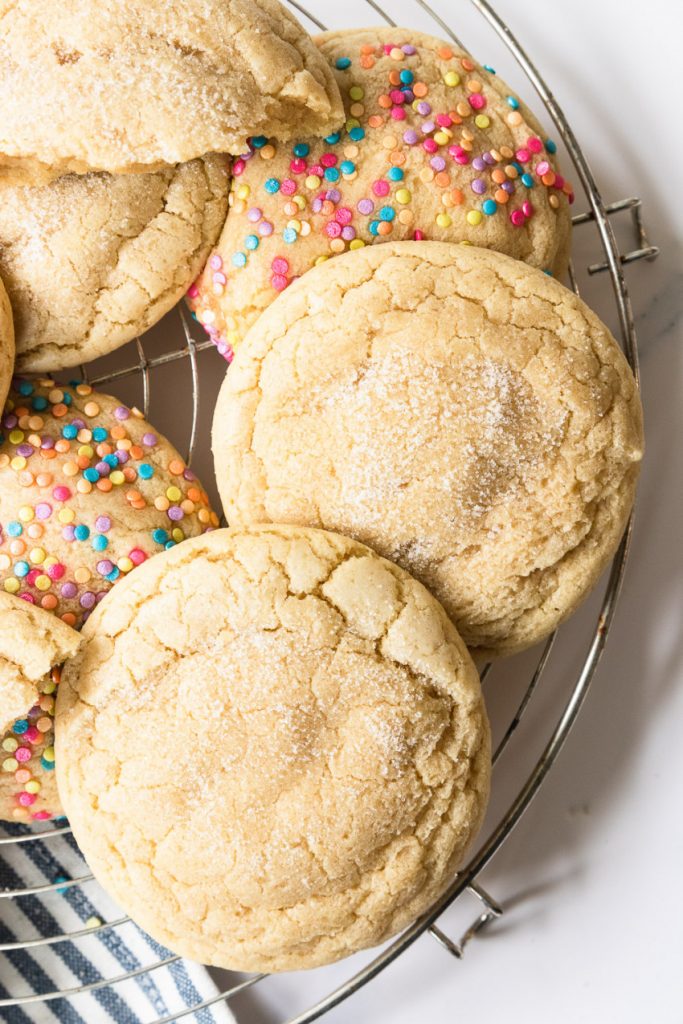 Soft, chewy sugar cookies on a cooling rack.