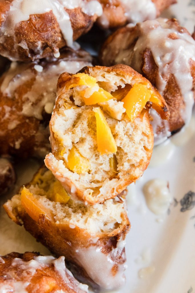 The inside of the fritter are soft with a crisp outside and loaded with peaches inside.