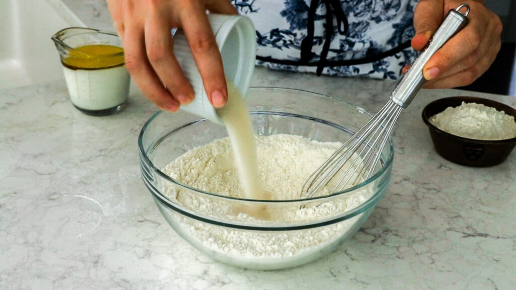Whisk together the dry ingredients-flour, yeast, sugar, and salt.
