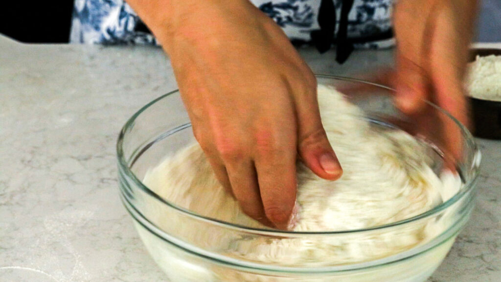 Use your hands (or a spoon) to mix the dough into a rough, shaggy dough.