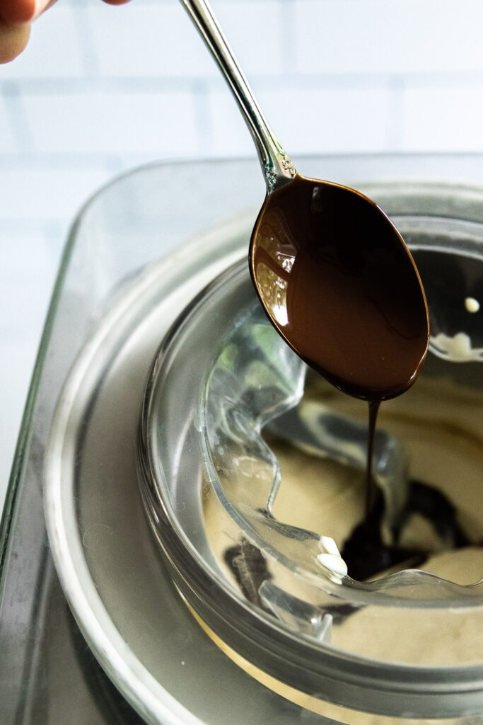 Drizzle the chocolate into the ice cream as it churns.