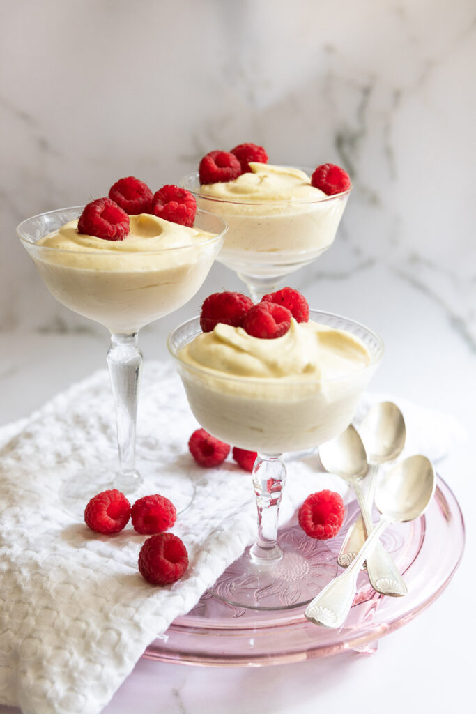 3 cups of vanilla mousse, garnished with fresh raspberries.