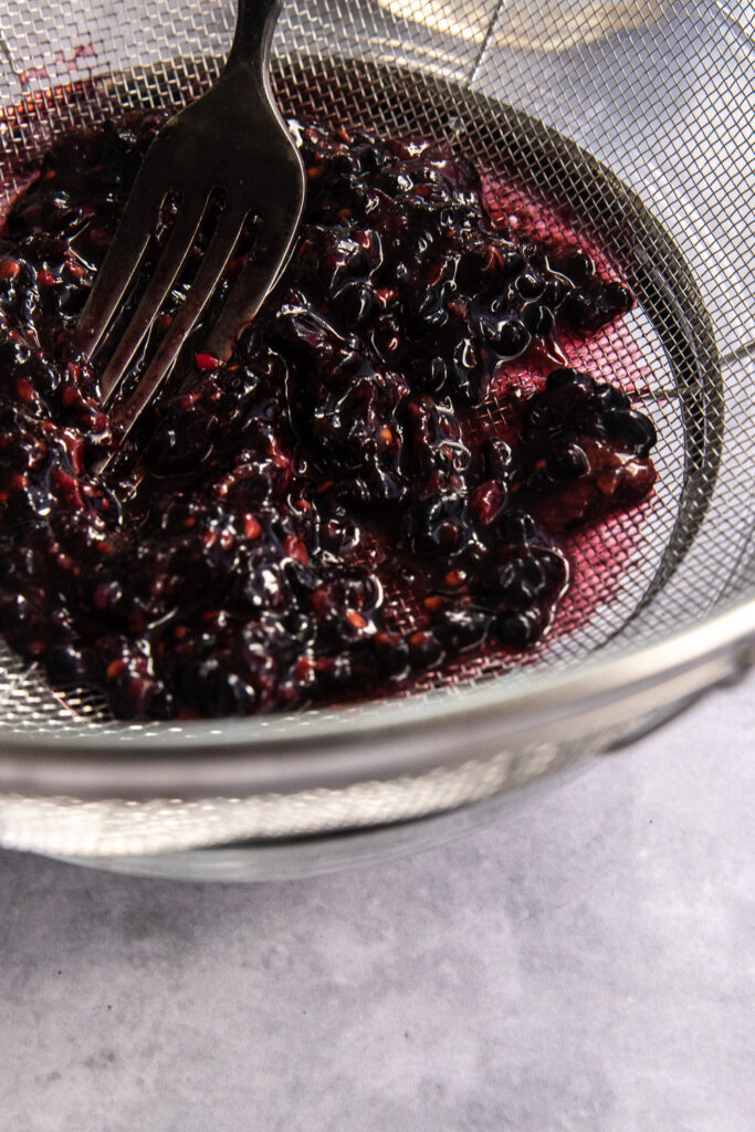 Smash the blackberries through a sieve to remove the juice.