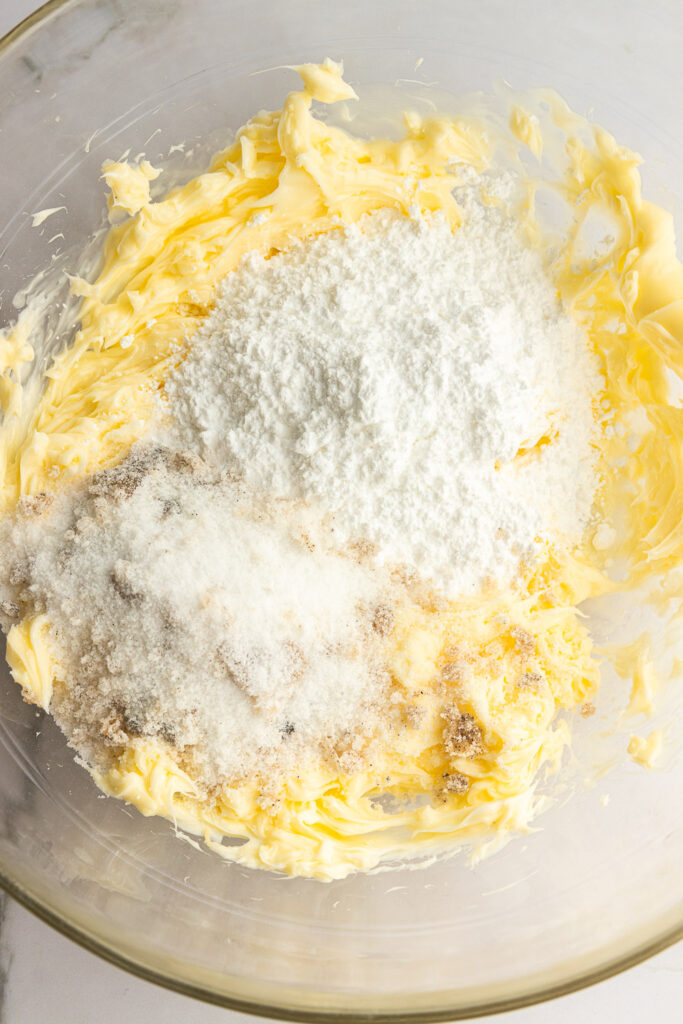 Mix both sugars into the soft butter.