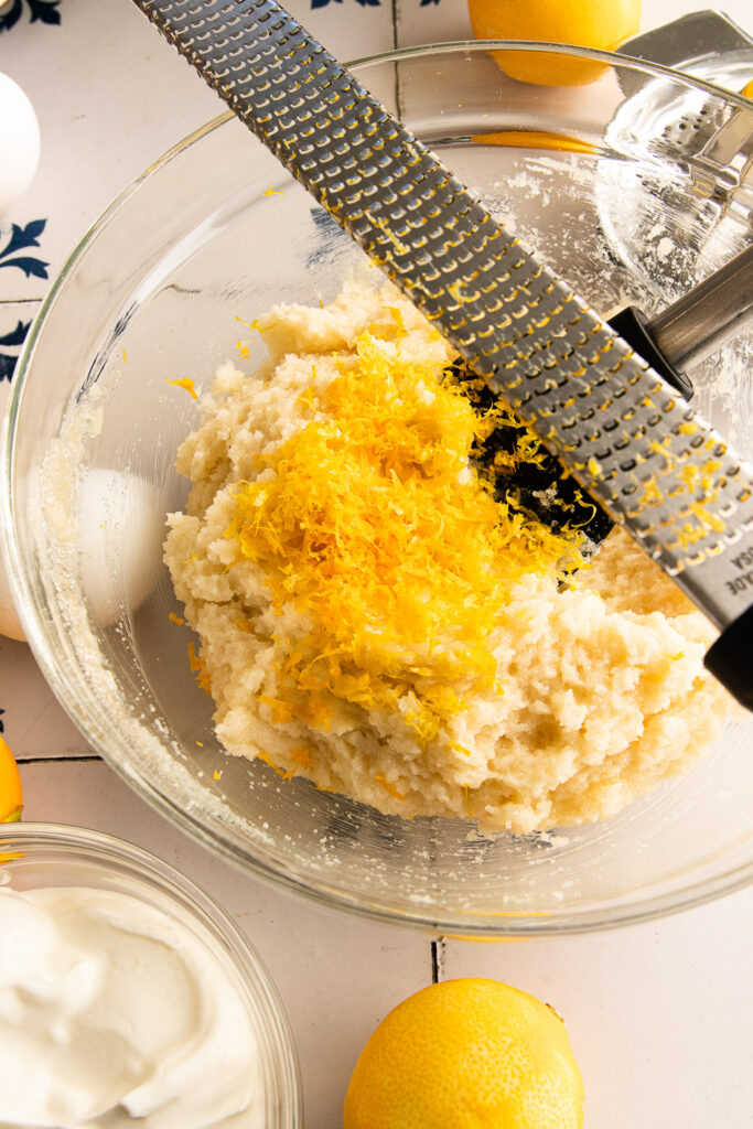Add the lemon zest to the creamed butter and sugar.