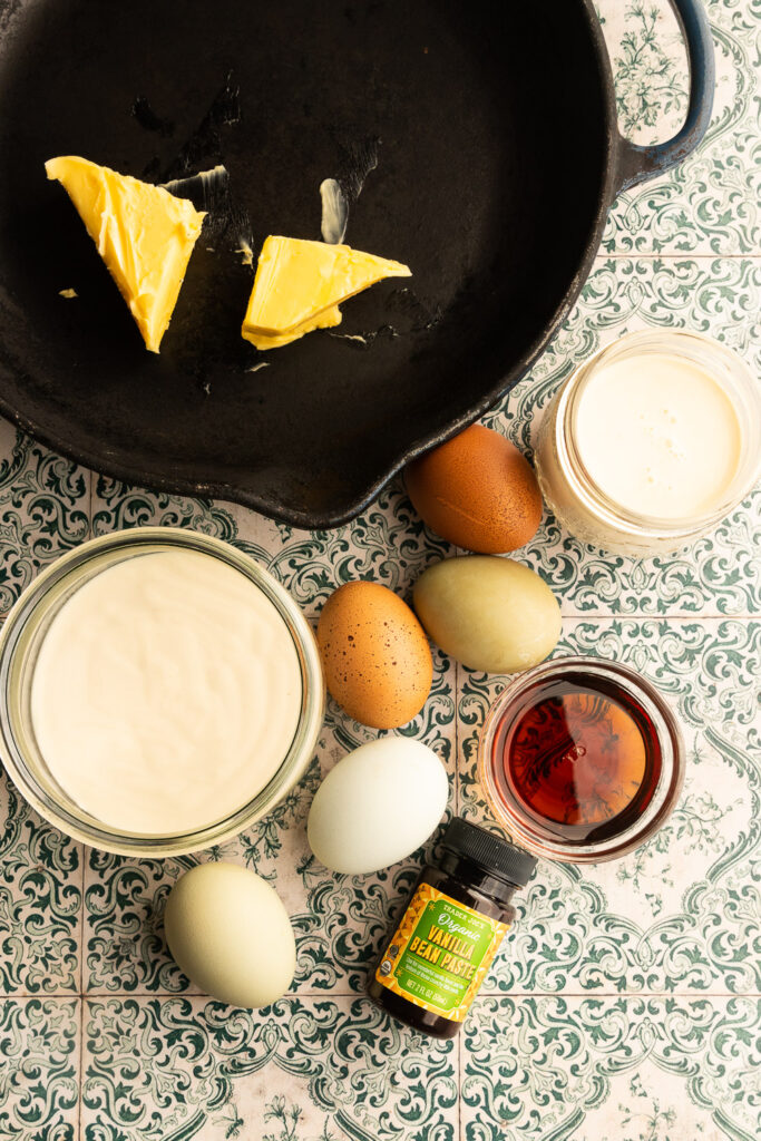 Sourdough Dutch Baby ingredients--eggs, sourdough discard, maple syrup, vanilla, and milk.