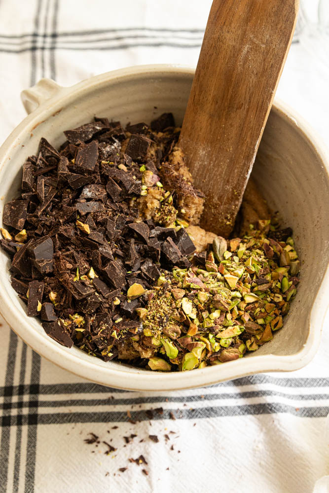 Stirring in the chopped chocolate and pistachios.