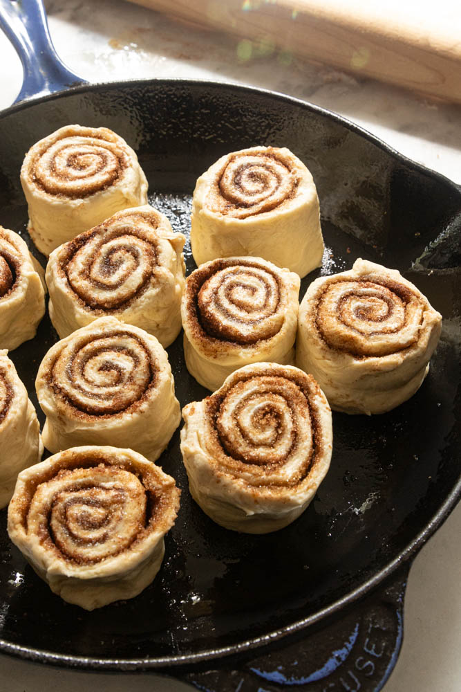 Sourdough discard cinnamon rolls, in a pan and ready to bake.