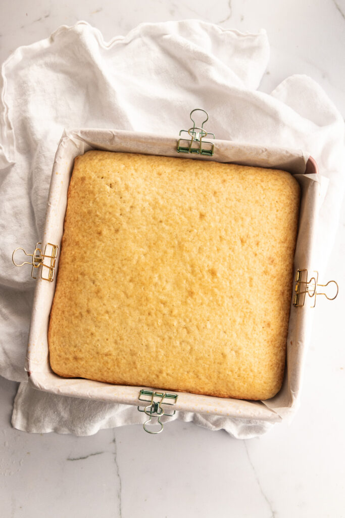 The sourdough cake after baking, with a light golden brown color on the top.