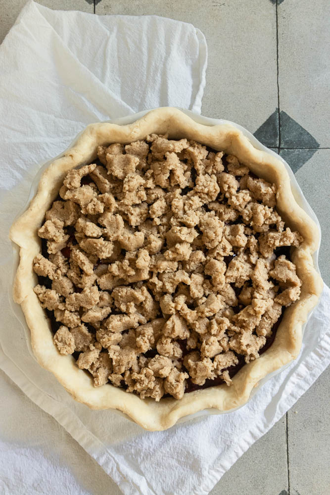 The pie, topped with crumble topping, before baking.