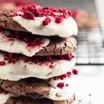 Flourless Brownie Cookies Dipped in White Chocolate and Topped with Dried Raspberries