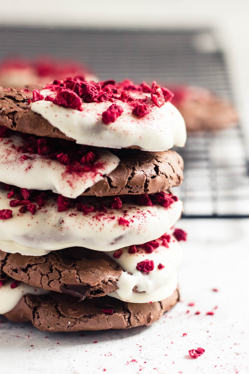 Flourless Brownie Cookies Dipped in White Chocolate and Topped with Dried Raspberries