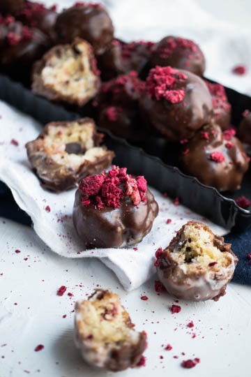 And old fashioned donut hole filled with chunks of chocolate and raspberries, then topped with a rich chocolate glaze and crushed freeze dried raspberries.