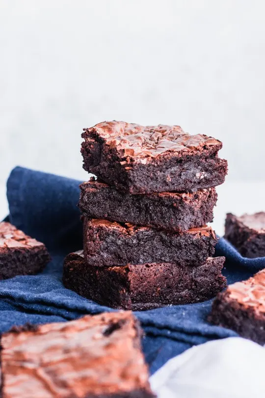 Fudge Brownies stacked on napkin