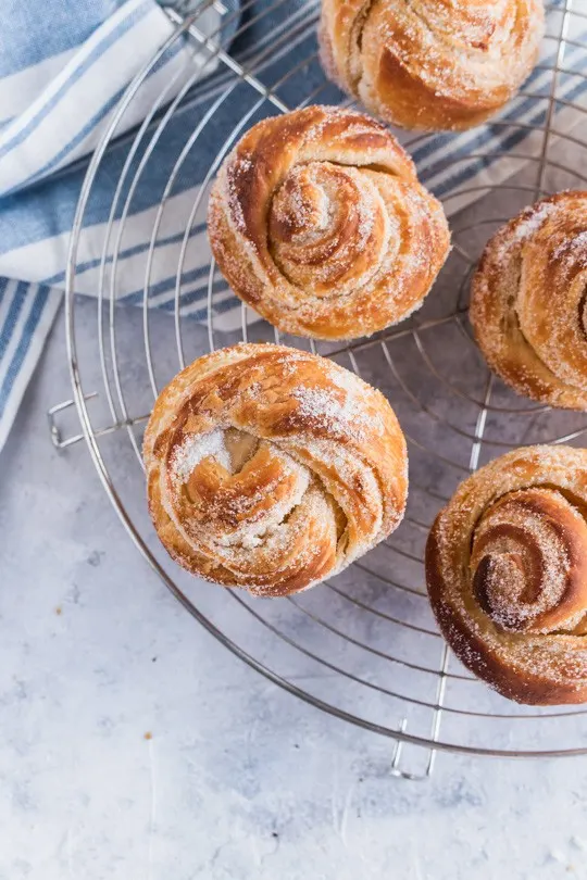 Closeup of cruffins on a wire rack