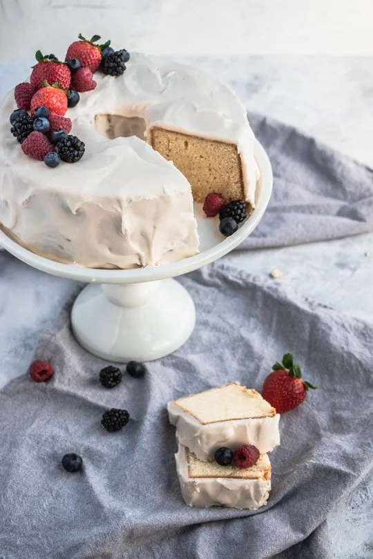 Sour Cream Pound Cake on table with fresh fruit.