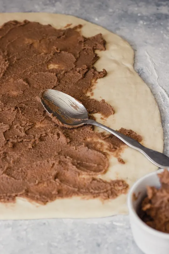 Fill cinnamon rolls with butter, brown sugar, and cinnamon