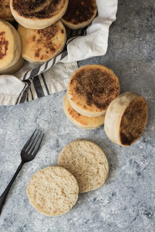 A stack of toasty, fresh sourdough English Muffins