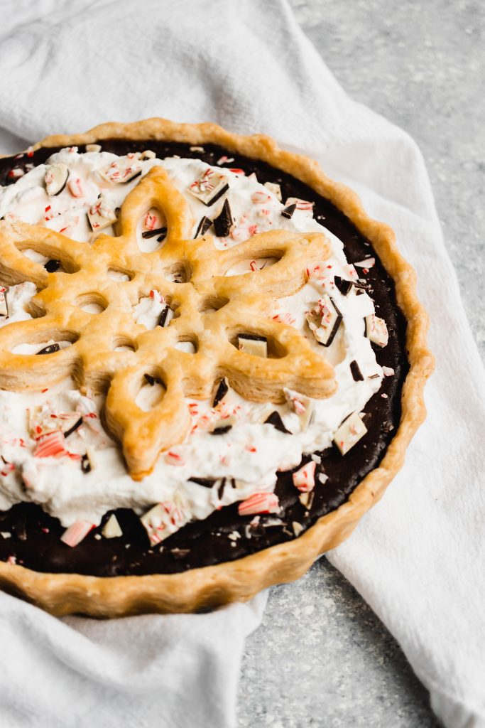 Peppermint Chocolate Pie, topped with whipped cream and a giant crust snowflake