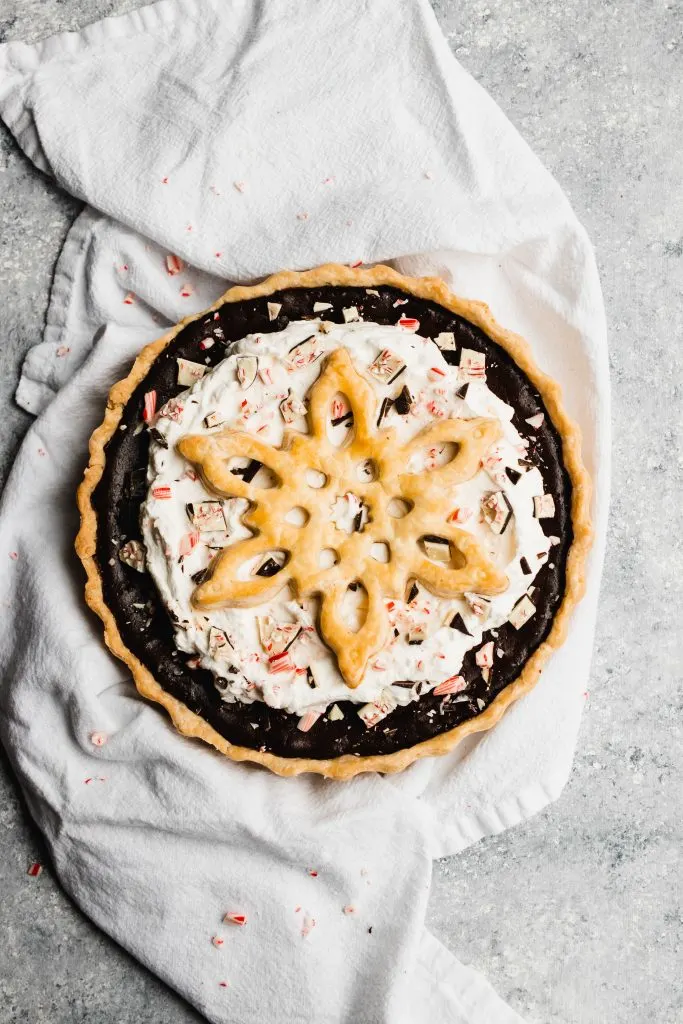 Peppermint Chocolate Pie, topped with whipped cream and a giant crust snowflake