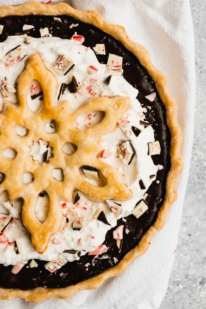 Peppermint Chocolate Pie, topped with whipped cream and a giant crust snowflake