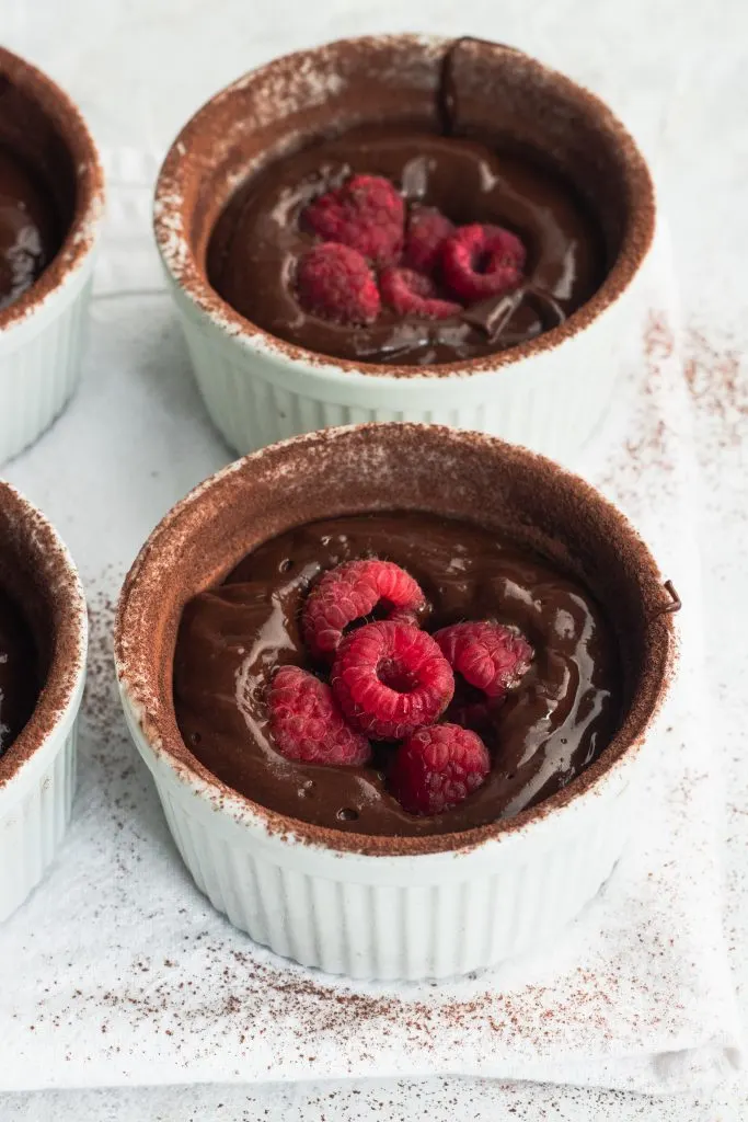 Chocolate Lava Cake Batter with Raspberries tucked in the center