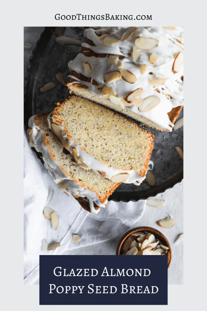 A loaf of Glazed Almond Poppy Seed Bread topped with sliced almonds