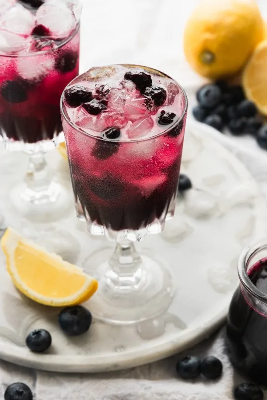 A glass of sparkling blueberry lemonade