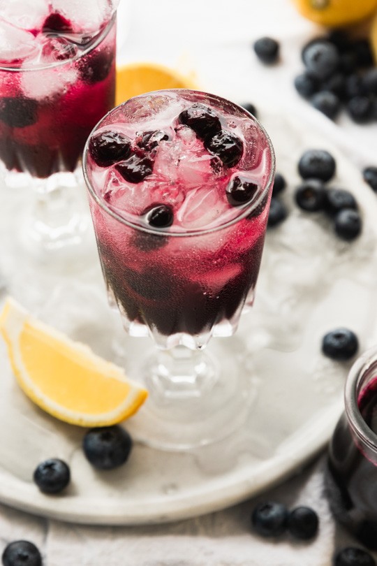 A glass of sparkling blueberry lemonade