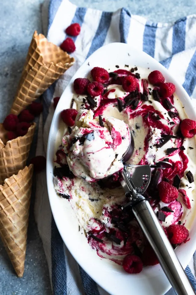 A scoop of chocolate and raspberry swirl ice cream