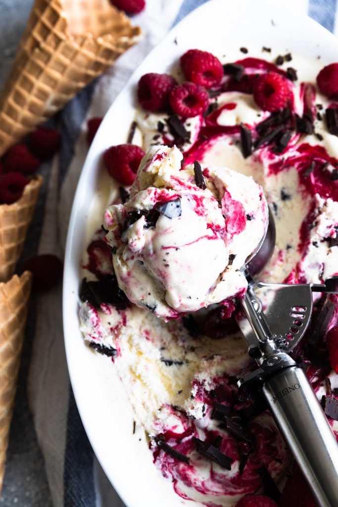 A scoop of chocolate and raspberry swirl ice cream