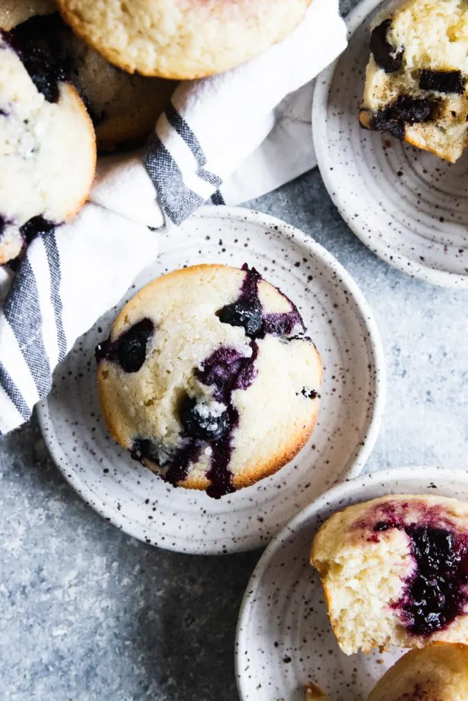 A sourdough muffin bursting with blueberries