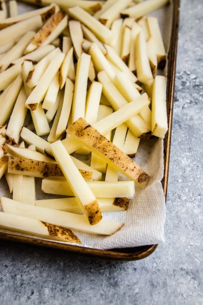 Raw potatoes, cut into matchsticks and ready for frying.