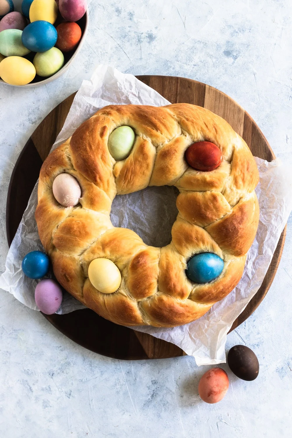 Italian Easter Bread is a braid circle loaf decorated on top with dyed Easter eggs.