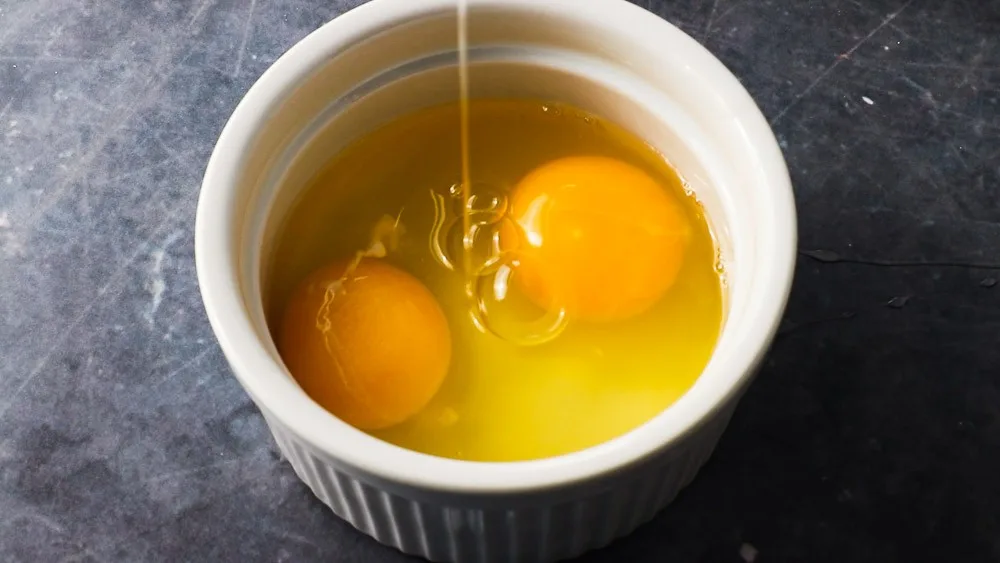 Two large eggs are added to the wet ingredients.