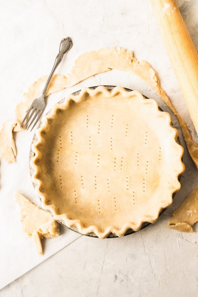 A prepared, docked pie crust that's ready to be blind baked.