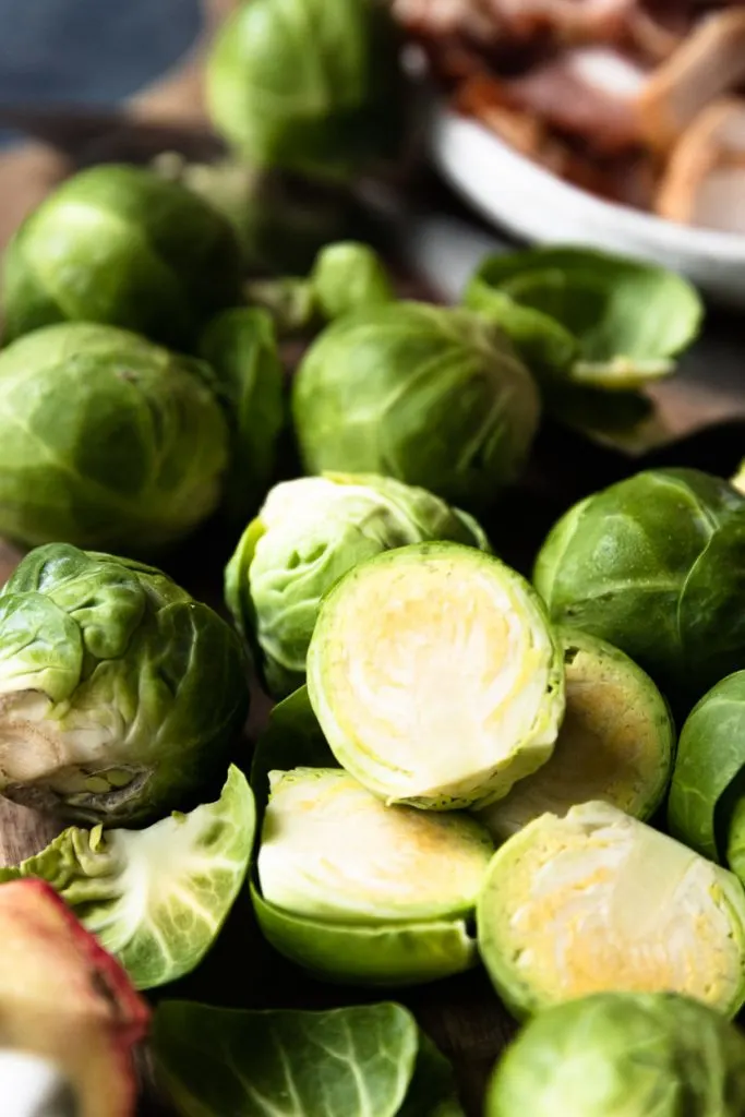 Cut the brussels sprouts in half and peel off the outer leaves.