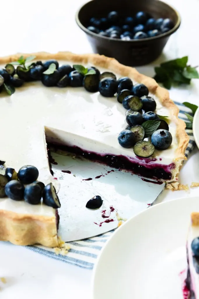 The blueberry panna cotta tart, cut open to show the layers.