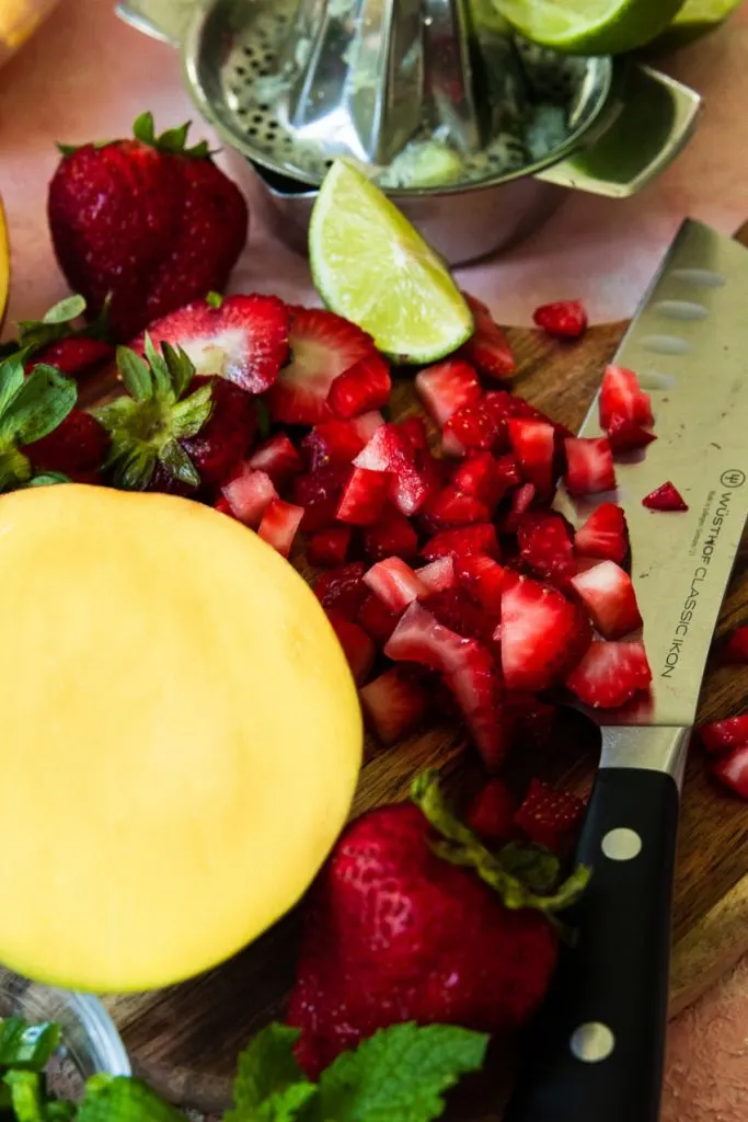 Chop the salsa ingredients--strawberries and mangos--into small pieces about 1/4."