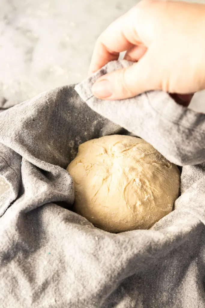 Covering the bread for it's second rise (after shaping) to keep the dough from drying out.