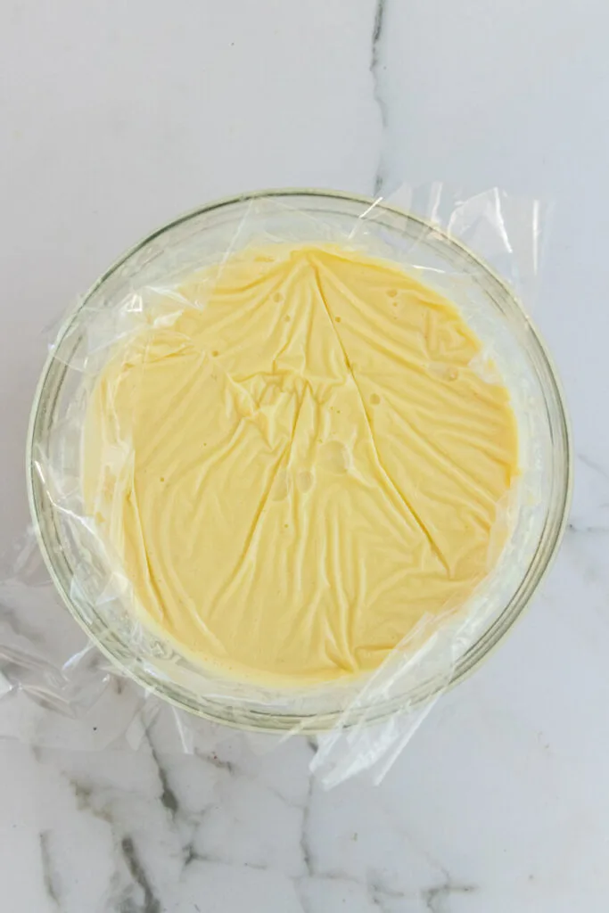 Cover the custard with plastic wrap directly on top to prevent it from drying out on top.